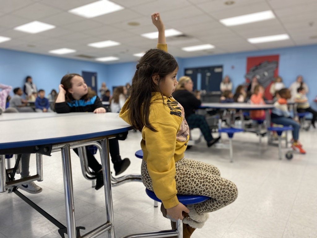 student raising her hand